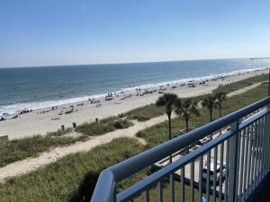 a view of a beach with a lot of people at 2501 S Ocean Blvd, 0707 - Ocean Front Sleeps 6 in Myrtle Beach