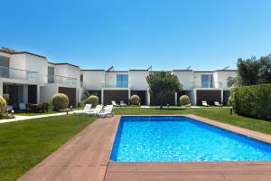 a swimming pool in the backyard of a house at Villa Blue Sagres D in Sagres