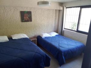 Letto o letti in una camera di Naranjo Hostel