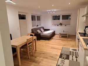 a living room with a couch and a table at Ferienwohnung Sole in Niederau