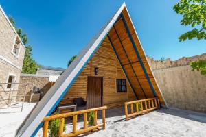 a house shaped like a pyramid with a door at ÑAÑO V in San Antonio de las Alzanas