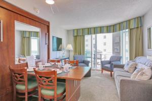 a living room with a table and a couch at 2501 S Ocean Blvd, 1017 - Ocean View Sleeps 6 in Myrtle Beach