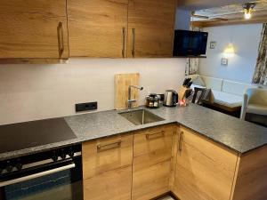 a kitchen with a sink and a counter top at Alkira in Sankt Anton am Arlberg