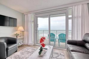 a living room with a view of the ocean at 2501 S Ocean Blvd, 0407 - Ocean Front Sleeps 6 in Myrtle Beach