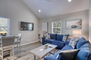 a living room with a blue couch and a table at 1408 Perrin Dr, Unit D - Ocean Walk Sleeps 8 in Myrtle Beach