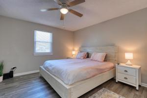a bedroom with a bed and a ceiling fan at 1408 Perrin Dr, Unit D - Ocean Walk Sleeps 8 in Myrtle Beach