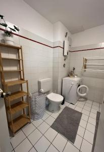 a bathroom with a toilet and a sink at No2 by 21 Apartments in Kaarst