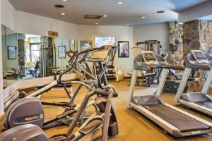 a gym with several tread machines in a room at Spectacular Views, Pool, Hot Tub, Mountain Village in Big Sky