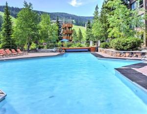 a swimming pool with blue water at Spectacular Views, Pool, Hot Tub, Mountain Village in Big Sky