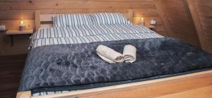 Ένα ή περισσότερα κρεβάτια σε δωμάτιο στο Owl House Jelovica