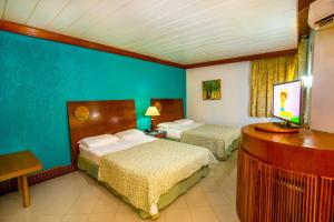 Cama ou camas em um quarto em Resort Arcobaleno All Inclusive