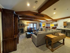 a living room with a couch and a table at The Chateaux Deer Valley in Park City