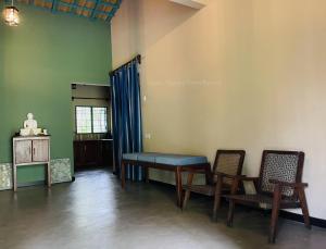 a room with a table and two chairs and a table at Liyara Nature Farm Resort in Gampaha