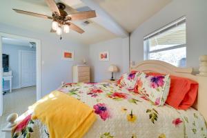 a bedroom with a bed and a ceiling fan at Cozy Bandera Cottage with Medina River Access! in Bandera +24 photos