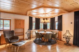 a dining room with a table and chairs at Love the Alps Apartments in Reith bei Seefeld