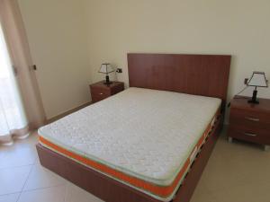 Cama o camas de una habitación en Aati Apartment