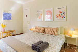 A bed or beds in a room at Casa la Fontana - Hostatel