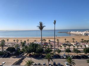 a view of the beach from the balcony of a resort at Bord de la mer Agadir in Agadir