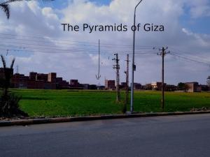a sign for the pyramids of giza on the side of a road at Duck Nest (Kak Kak) in Cairo