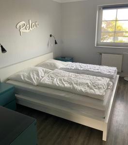 Ένα ή περισσότερα κρεβάτια σε δωμάτιο στο Residenz Rosengrund WHG O3 +19 φωτογραφίες