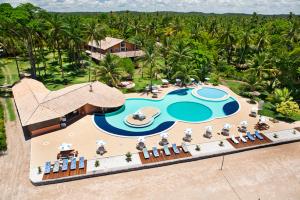an aerial view of a resort with a swimming pool at Hotel Karapitangui in Morro de São Paulo