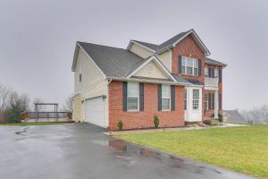 a house with a driveway in front of it at Cozy Inwood Apartment History, Hiking and Wine! in Inwood