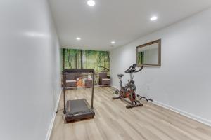 a gym with two exercise bikes and a mirror at Cozy Inwood Apartment History, Hiking and Wine! in Inwood
