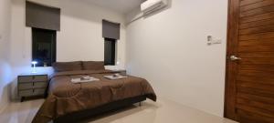 Ένα ή περισσότερα κρεβάτια σε δωμάτιο στο Cozy workation house