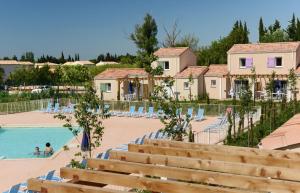 a view of the pool at a resort at Résidence Odalys Le Mas des Alpilles in Paradou