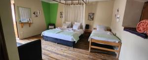 A bed or beds in a room at Loki Cusco