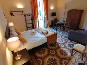 Postel nebo postele na pokoji v ubytování B&B Genova Centro