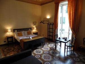 Postel nebo postele na pokoji v ubytování B&B Genova Centro