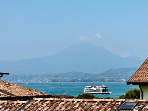 a cruise ship on the water in the ocean at Appartamento Blue View in Peschiera del Garda