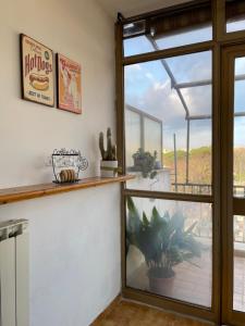 a room with a large window and a fish tank at Ilaria’s Apartment in Rome +14 photos