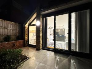 a large glass door with a view of a patio at Nancys Place in Notting Hill hosted by AirOperate in London