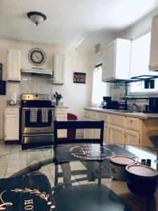 a kitchen with a table and a stove top oven at Cozy 2 bedroom 1 bath unit in Anderson