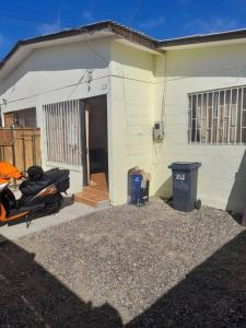 a motorcycle parked in front of a house at arriendo casa para 6 personas in Caldera