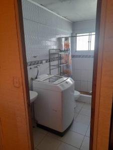 a small bathroom with a sink and a toilet at arriendo casa para 6 personas in Caldera