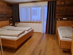 Posteľ alebo postele v izbe v ubytovaní Zimmer & Appartements Schwarzenbacher Sonja & Konrad