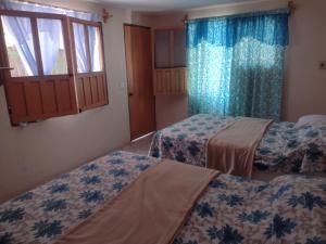 Llit o llits en una habitació de Santuario Iguanario