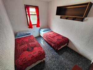 A bed or beds in a room at Hostal Bodegon