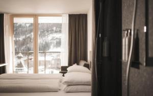 Sportlers Lodge Sölden lifestyle-lässig-anders客房内的一张或多张床位