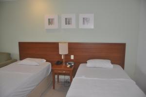 Katil atau katil-katil dalam bilik di Flat em Resort com vista para o Mar! +30 gambar