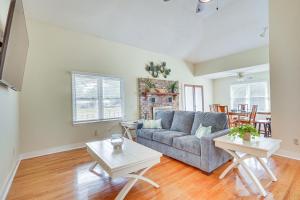 a living room with a couch and a table at Secluded Mount Pleasant Home - 6 Mi to Beaches! in Charleston