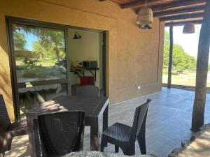 a patio with a table and chairs and a table and chairsktop at Casa Algarrobos in San Javier