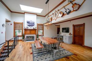 a dining room with a table and a fireplace at The Western Allure in Denver