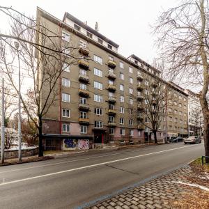 an empty street in front of a building at Apartmán pod Špilberkem in Brno