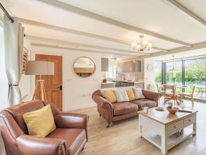 a living room with a couch and a table at 3 Bed in Northumberland National Park CN039 in Alwinton