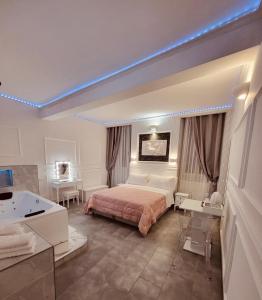 a hotel room with a bed and a bath tub at A&F Colosseo in Rome