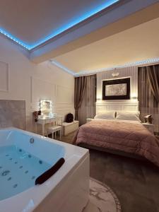 a bedroom with a bed and a bath tub at A&F Colosseo in Rome